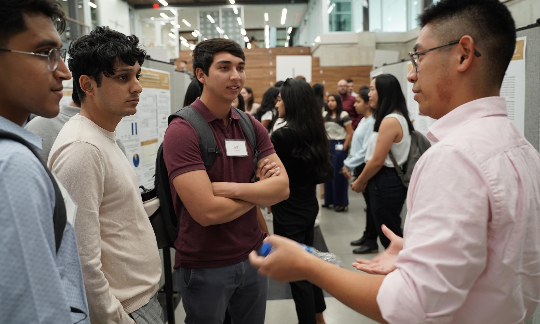 An image of Tai Metzger and classmates at a research event