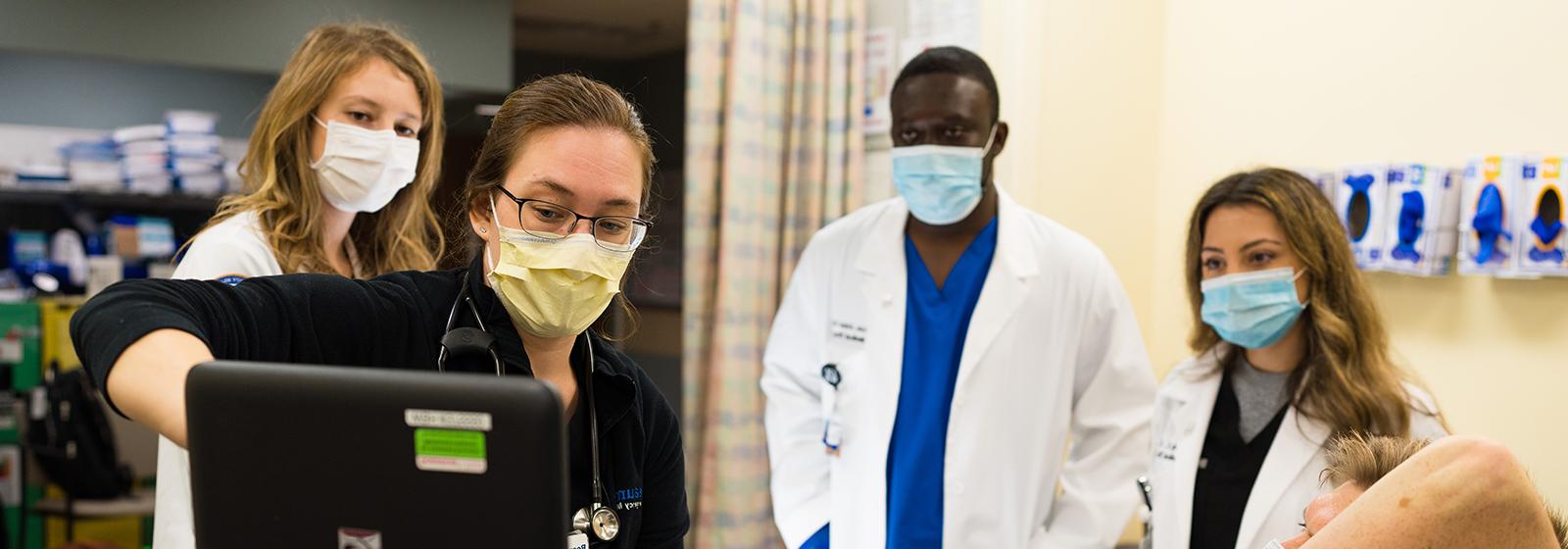 An image of clinical faculty teaching students